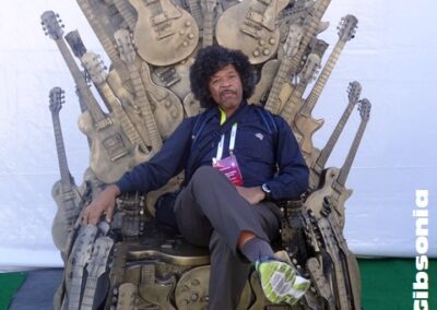 Image sitting on throne of Gibson Guitars by John L. Wood